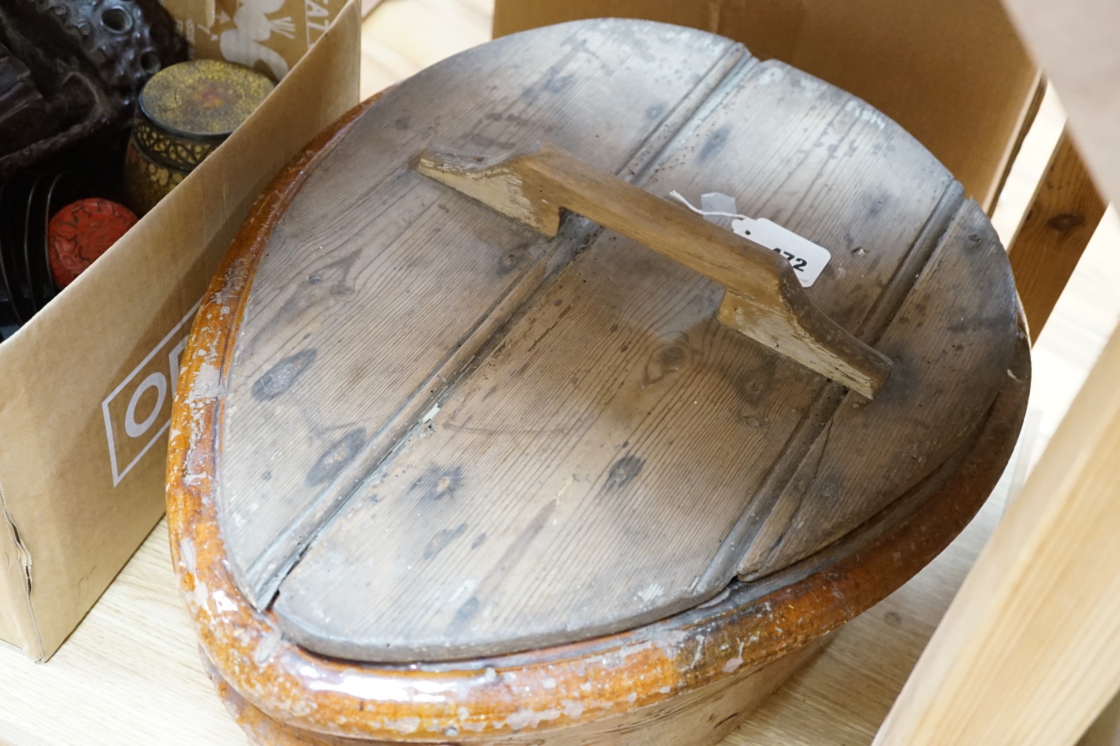 A 19th Century French terracotta ham-smoking pot with original wooden lid